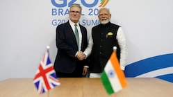 British PM Keir Starmer (L) and his India counterpart Narendra Modi shake hands during a bilateral meeting on the sidelines of the G20 summit